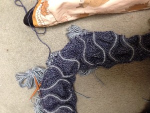 On the second pattern repeat. The MC skein is safely tucked into the bag, and notice that the butterflies are all being kept close to the knitting needle. This tip really helps prevent tangling with intarsia.