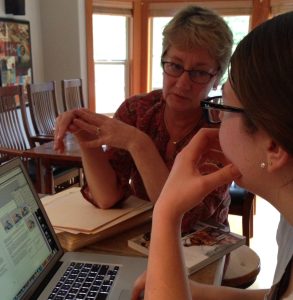Sarah and Ann, at the photoshoot for Annetarsia Knits, going through the days' shots.